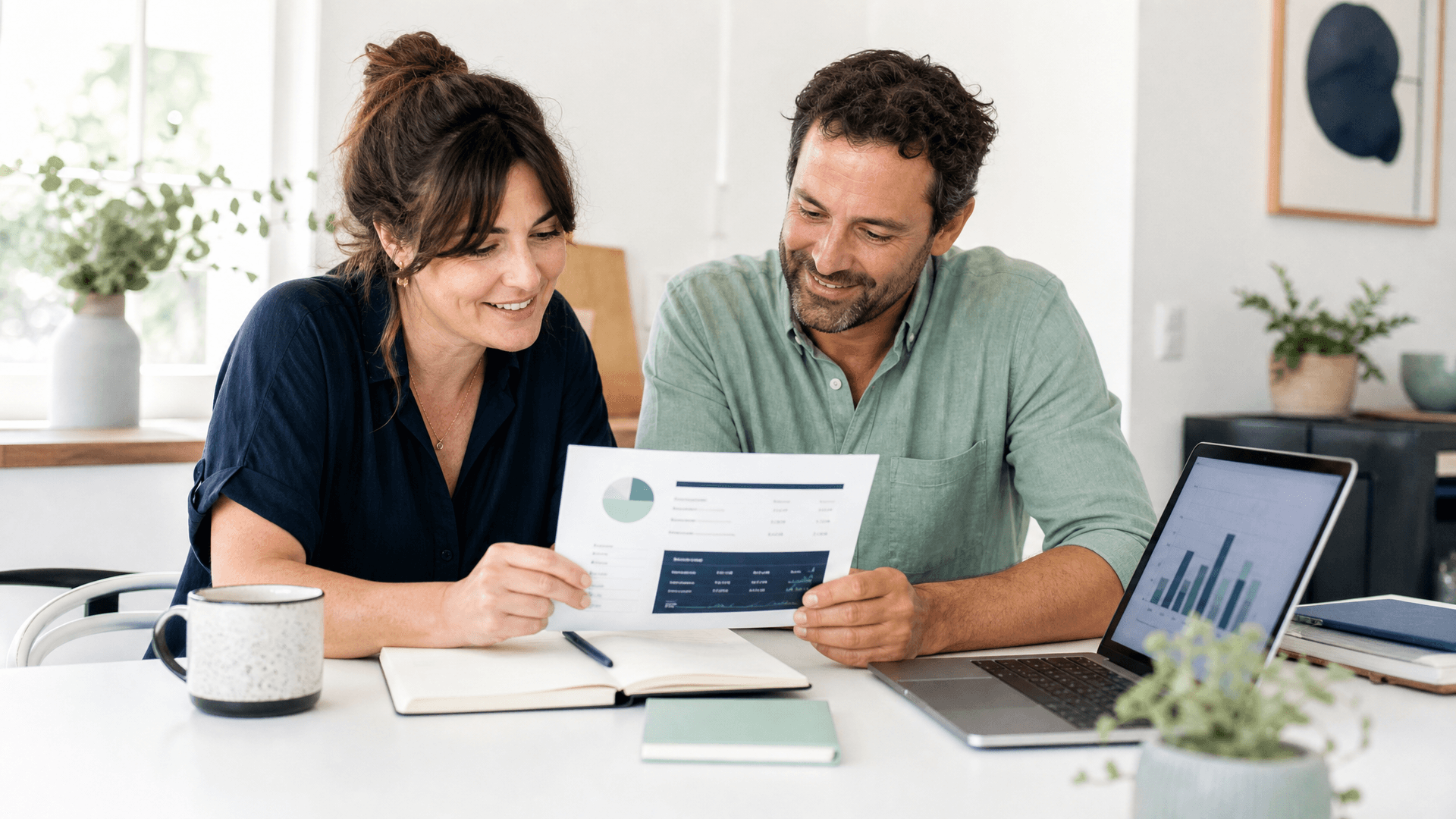 Two partners reviewing a one-page numbers summary